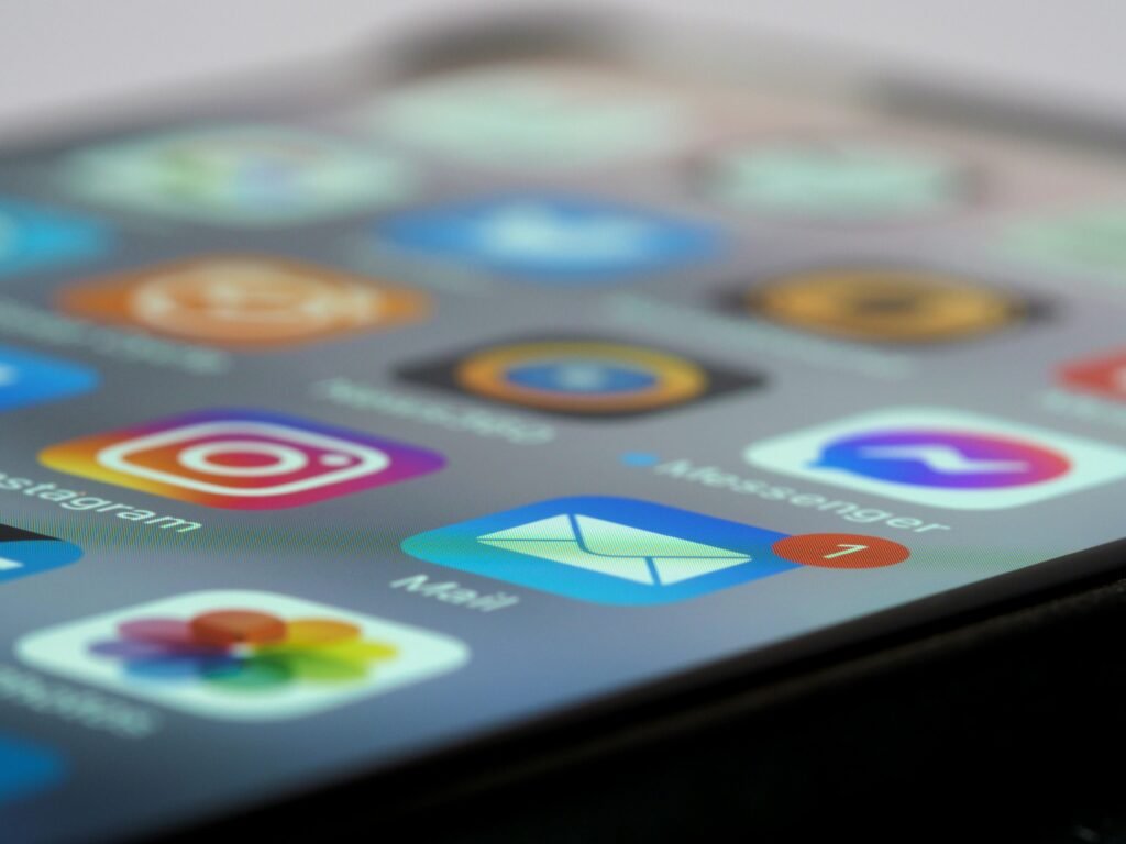Detailed close-up of smartphone screen displaying various app icons and notifications.